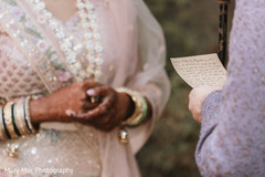 Indian groom reading his vows to the beautiful maharani Indian groom reading his vows to the beautiful maharani