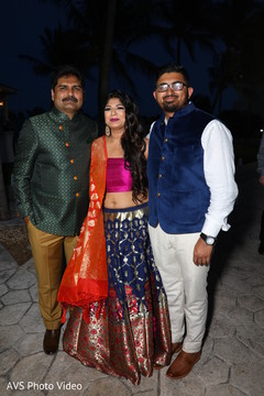 Enchanting Indian bride posing with relatives. Enchanting Indian bride posing with relatives.