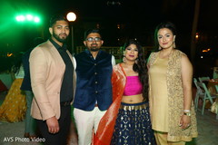 Lovely Indian couple posing with friends. Lovely Indian couple posing with friends.