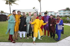 Indian groom with groomsmen on their sangeet outfits. Indian groom with groomsmen on their sangeet outfits.