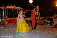 Indian bride and bridesmaids performing a sangeet dance. Indian bride and bridesmaids performing a sangeet dance.