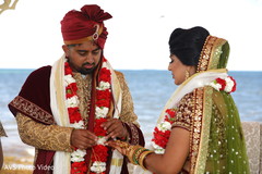 Sweet Indian couple exchanging rings. Sweet Indian couple exchanging rings.