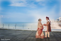 Ravishing Indian bride and groom posing out doors. Ravishing Indian bride and groom posing out doors.