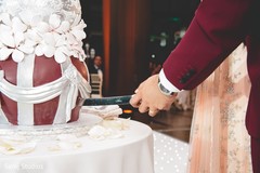 Indian bride and groom cutting the cake Indian bride and groom cutting the cake