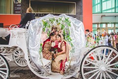 Indian bride and groom in their fantastic carriage Indian bride and groom in their fantastic carriage