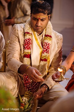 Indian groom given the sacred fire capture. Indian groom given the sacred fire capture.