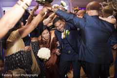 Indian newlyweds making their entrance to wedding reception. Indian newlyweds making their entrance to wedding reception.
