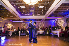 Indian groom dancing with parent capture. Indian groom dancing with parent capture.