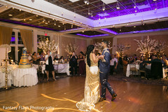 Lovely Indian couple enjoying their first dance capture. Lovely Indian couple enjoying their first dance capture.