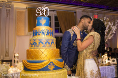 Indian wedding reception cutting the cake scene. Indian wedding reception cutting the cake scene.