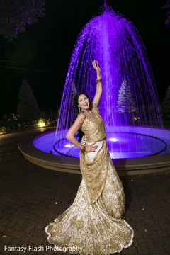 Charming Indian bride posing on her reception outfit. Charming Indian bride posing on her reception outfit.