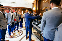 Indian groom admiring present. Indian groom admiring present.