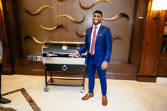 Enchanting groom posing with present. Enchanting groom posing with present.