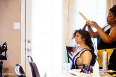 Indian bridesmaid getting her hair done. Indian bridesmaid getting her hair done.