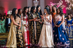 Lovely Indian bridesmaids giving a speech at the reception Lovely Indian bridesmaids giving a speech at the reception