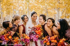 Indian bride posing with bridesmaids outdoors Indian bride posing with bridesmaids outdoors