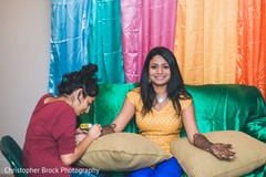 Lovely Indian bride getting her henna art done. Lovely Indian bride getting her henna art done.