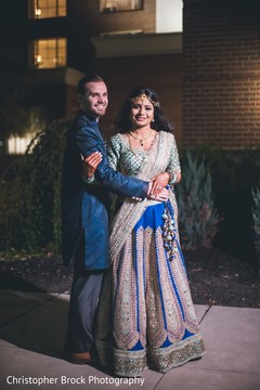 Dreamy Indian couple on their pre-wedding outfit outdoors portrait. Dreamy Indian couple on their pre-wedding outfit outdoors portrait.