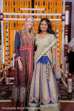 Lovely Indian bride posing with bridesmaid at sangeet. Lovely Indian bride posing with bridesmaid at sangeet.