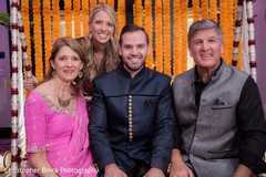 Gorgeous groom with family portrait. Gorgeous groom with family portrait.