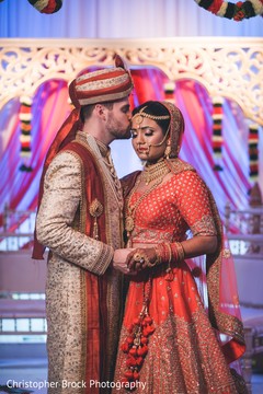 Lovely Indian groom kissing bride photo session. Lovely Indian groom kissing bride photo session.