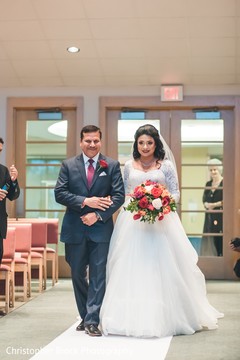 Adorable Indian bride walking in to her wedding. Adorable Indian bride walking in to her wedding.