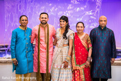 Indian bride and groom with family members Indian bride and groom with family members