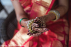 Glamorous Indian bride getting her jewelry on capture. Glamorous Indian bride getting her jewelry on capture.