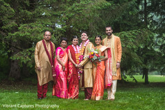 Charming Indian bride and groom with wedding guests. Charming Indian bride and groom with wedding guests.