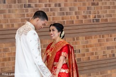 Cute Indian bride and groom's first look capture. Cute Indian bride and groom's first look capture.