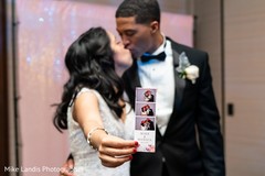 Most romantic indian bride and groom showing photos capture. Most romantic indian bride and groom showing photos capture.