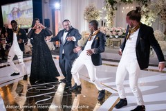 Indian groom dancing with special guests Indian groom dancing with special guests