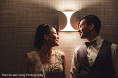 Indian newlyweds looking at each other during the photo shoot Indian newlyweds looking at each other during the photo shoot