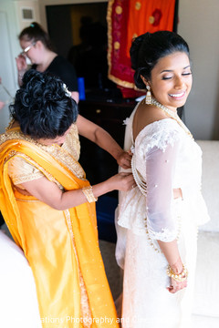 Maharani being assisted by special guest prior to the ceremony Maharani being assisted by special guest prior to the ceremony