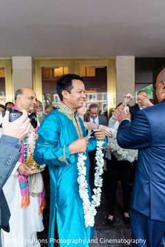 Indian wedding guest holding the flower garlands Indian wedding guest holding the flower garlands
