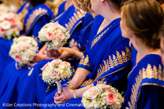 Indian bridesmaids holding the beautiful bouquets Indian bridesmaids holding the beautiful bouquets