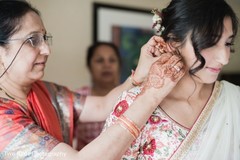 Indian bride being assisted by special guest Indian bride being assisted by special guest