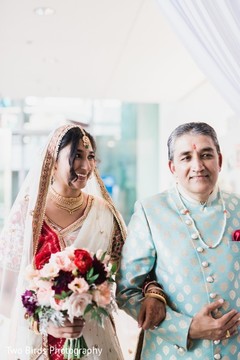Indian bride and her father at the beginning of the ceremony Indian bride and her father at the beginning of the ceremony