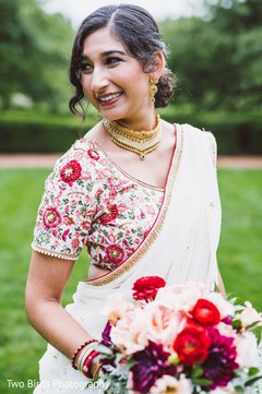 Indian bride posing for pictures outdoors Indian bride posing for pictures outdoors