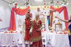 Indian lovebirds getting rose petals from guests. Indian lovebirds getting rose petals from guests.