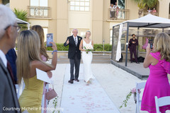 Indian bride walking in to her wedding with parent capture. Indian bride walking in to her wedding with parent capture.