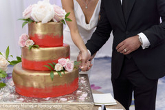 Indian wedding cutting the cake scene. Indian wedding cutting the cake scene.