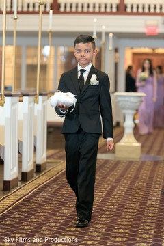 Gorgeous Indian page boy walking the aisle. Gorgeous Indian page boy walking the aisle.