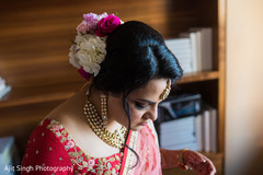 Indian bride wearing her Tikka, Polki necklace choker and Lehenga. Indian bride wearing her Tikka, Polki necklace choker and Lehenga.