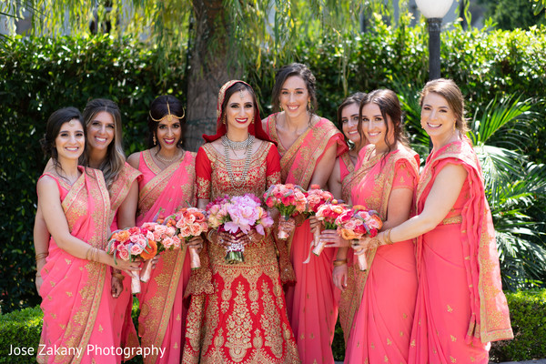 Indian bridesmaids posing with the stunning Maharani