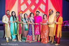 Stunning capture of Indian bride and groom with parents photo. Stunning capture of Indian bride and groom with parents photo.