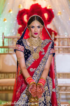Beautiful Indian bride showing her jewelry and henna art. Beautiful Indian bride showing her jewelry and henna art.