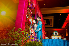 Lovely Indian wedding couple posing at sangeet. Lovely Indian wedding couple posing at sangeet.