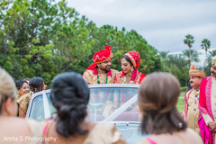 Joyful Indian bride and groom about to leave from ceremony. Joyful Indian bride and groom about to leave from ceremony.
