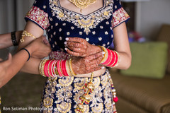 Indian bride putting bangles capture. Indian bride putting bangles capture.